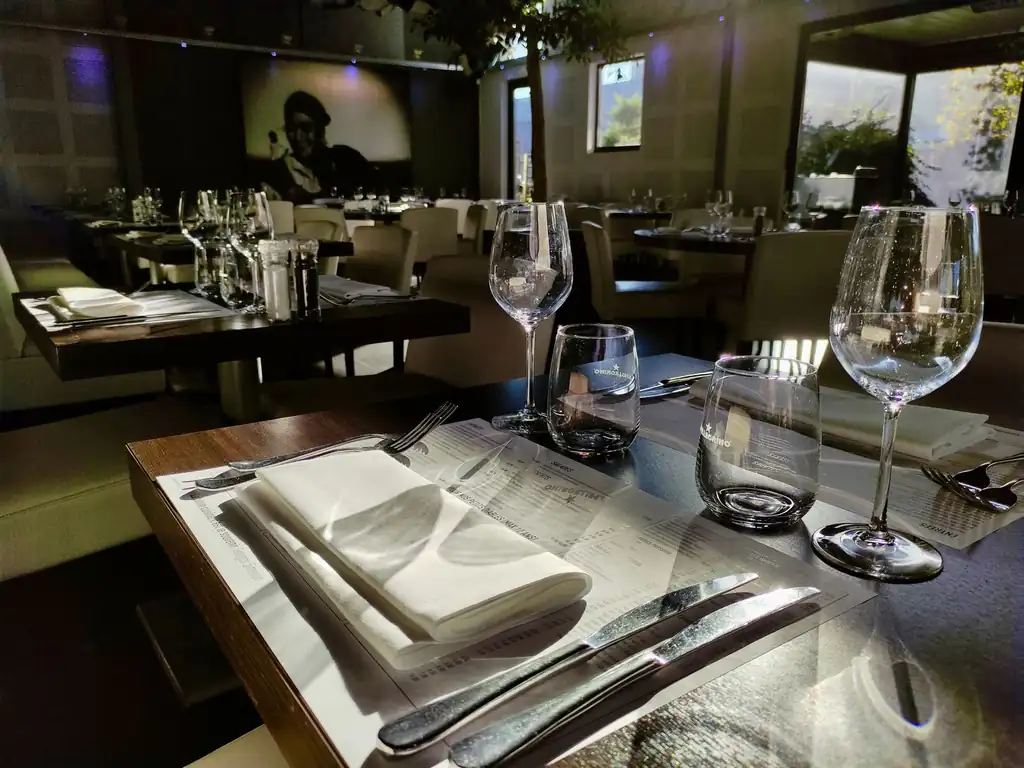 Elegant restaurant table setting with warm lighting