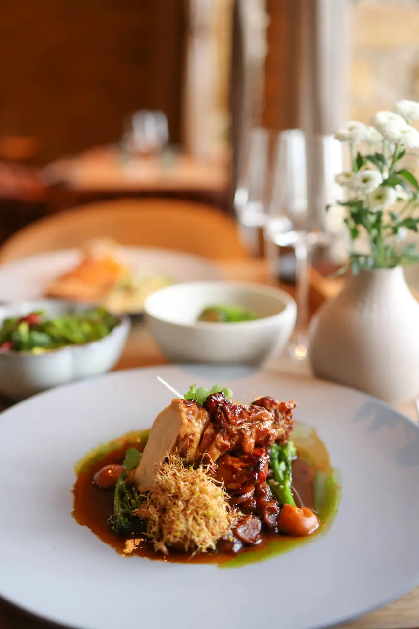 Plated gourmet chicken in a refined setting