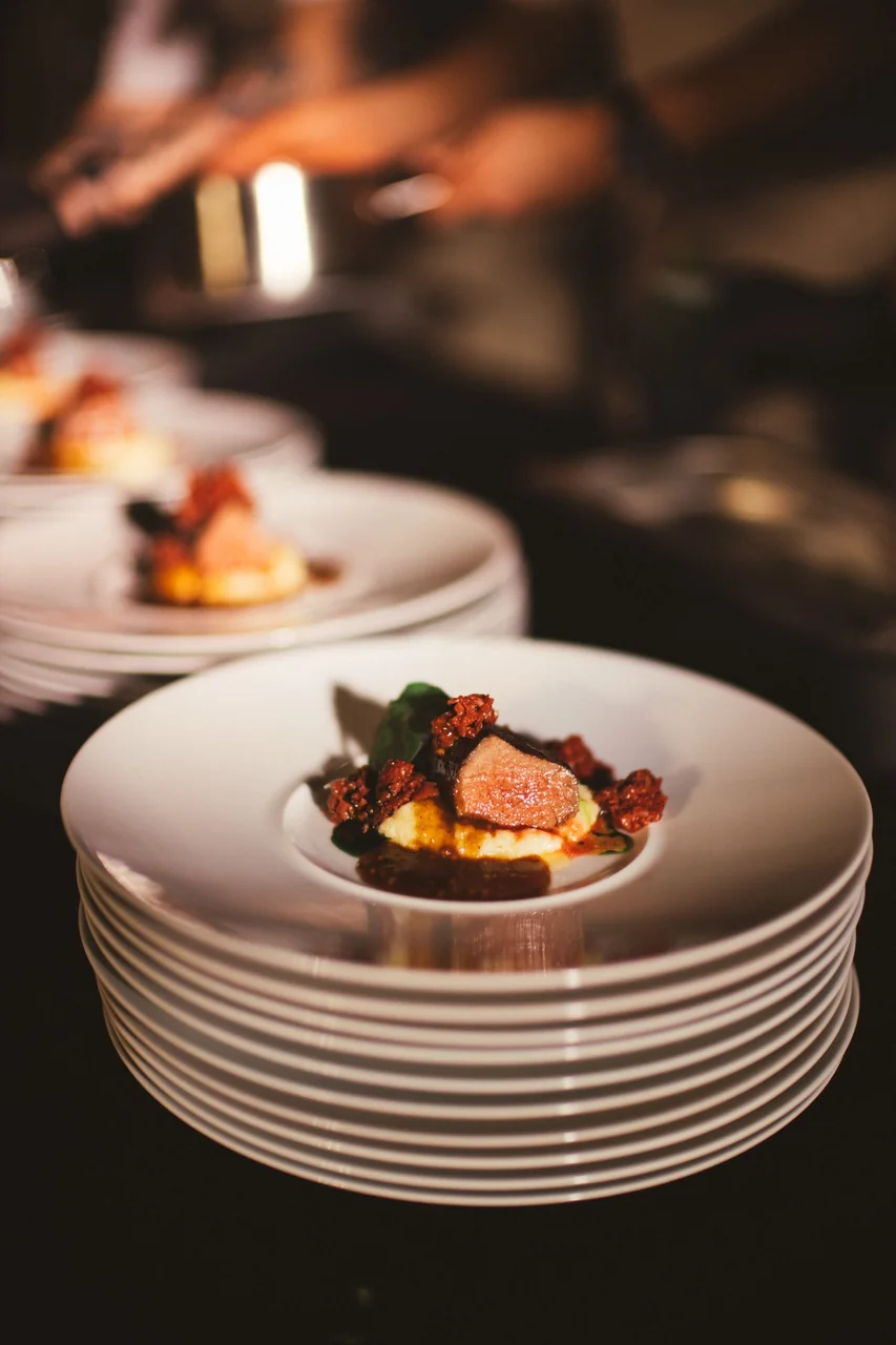 Stacked plates in a fine dining presentation